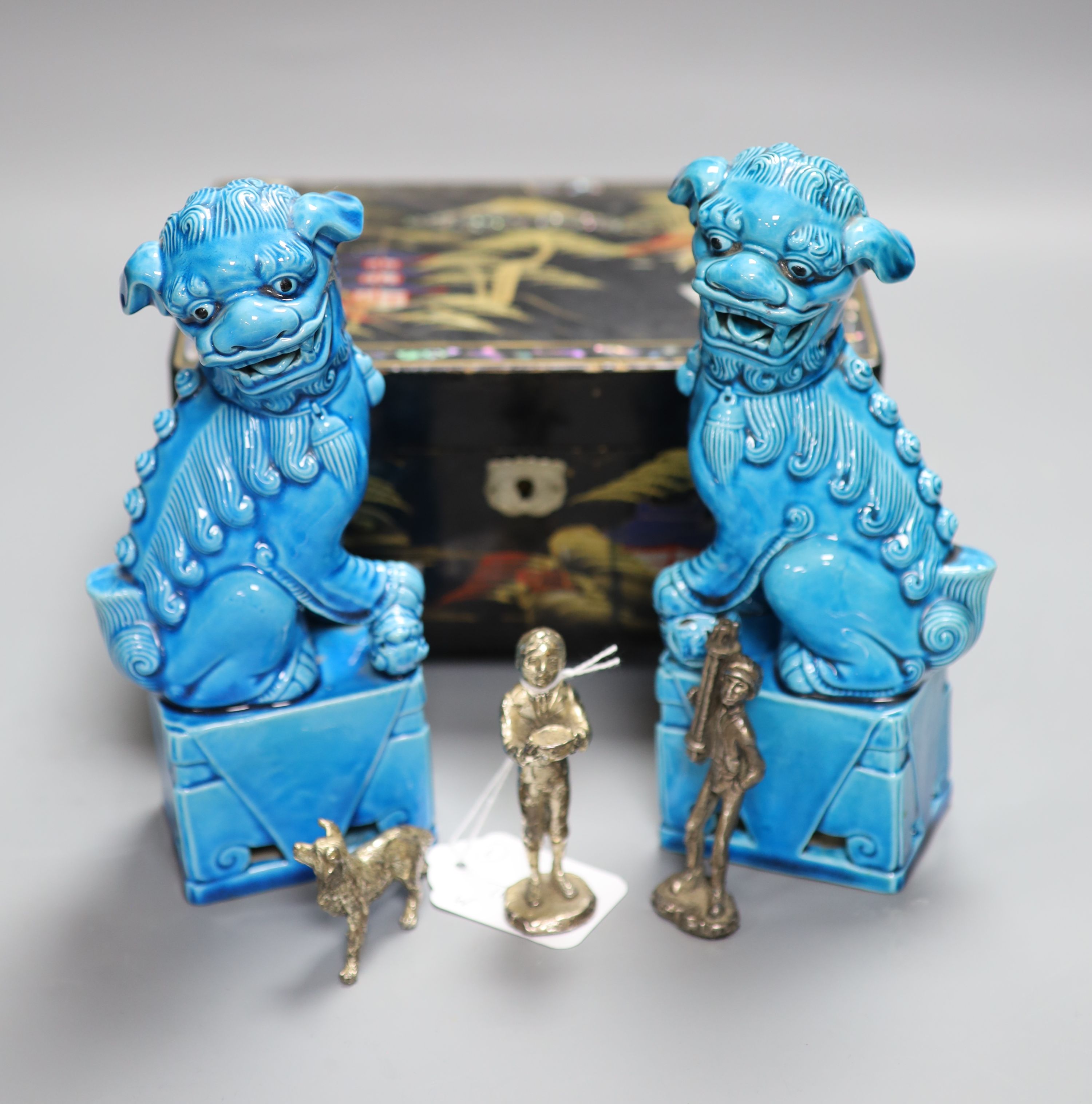 A pair of Chinese turquoise-glazed lion dogs, a lacquered jewellery box and three plated miniature figures